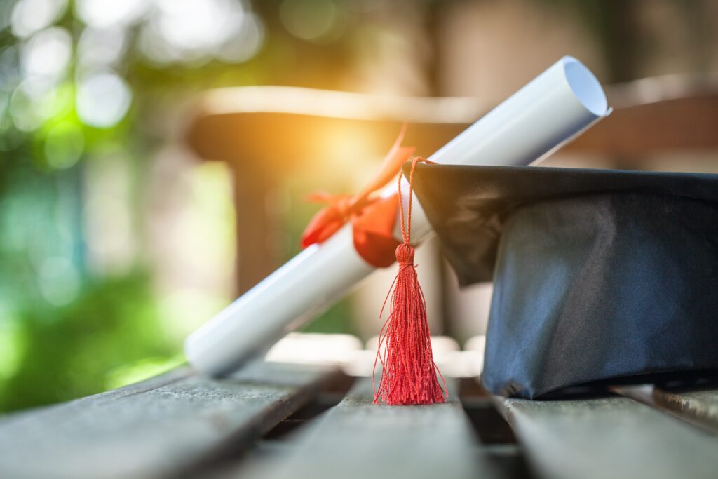 Mortarboard (graduation cap) and diploma